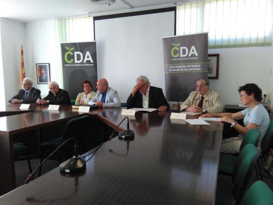 Signatura del conveni marc que regula els centres de distribució d'aliments